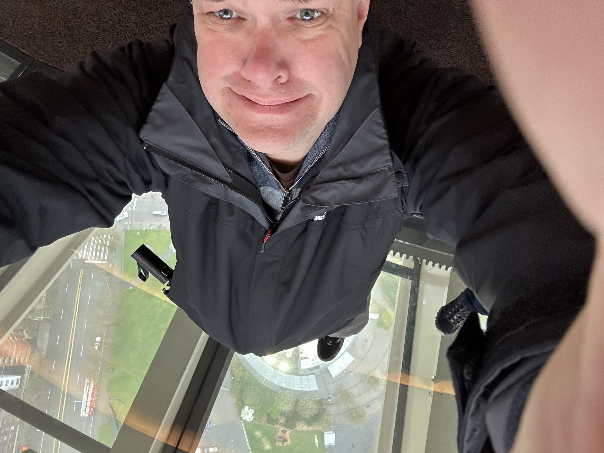 Image of space needle standing on glass floor